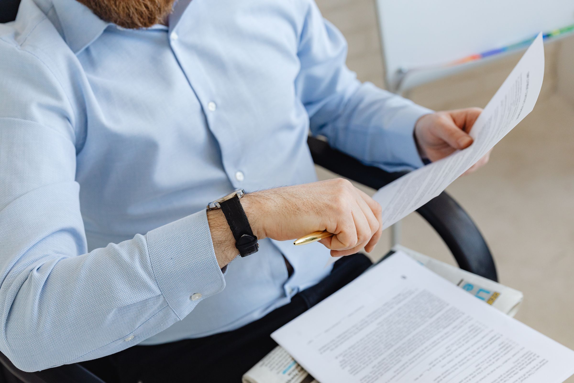 Professional reviewing documents with attention to detail in an office