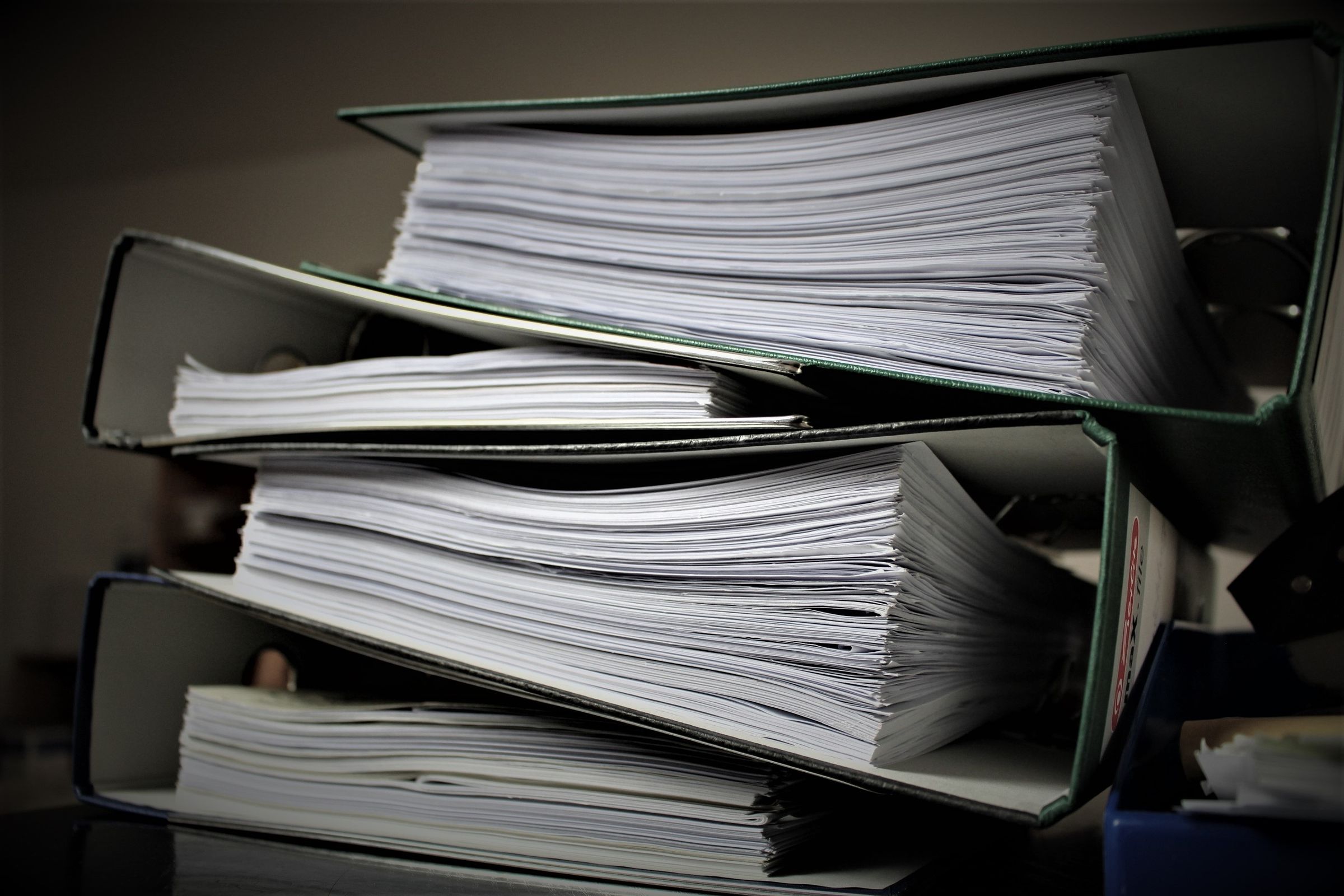 Stacked binders filled with organised documents